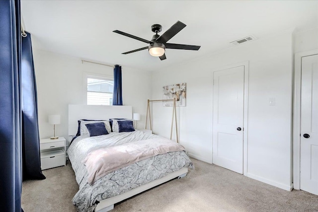 bedroom featuring visible vents, carpet floors, and ceiling fan