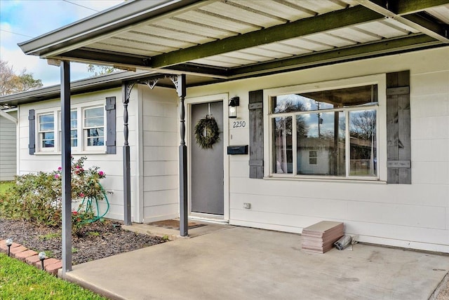 property entrance featuring a patio