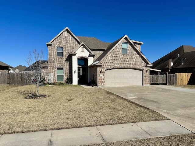 view of front of property with a garage and a front lawn