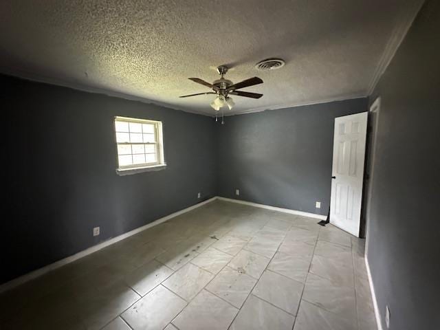 unfurnished room with a textured ceiling, visible vents, baseboards, ornamental molding, and a ceiling fan