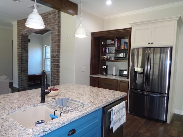 kitchen with dark wood finished floors, crown molding, stainless steel refrigerator with ice dispenser, and a sink