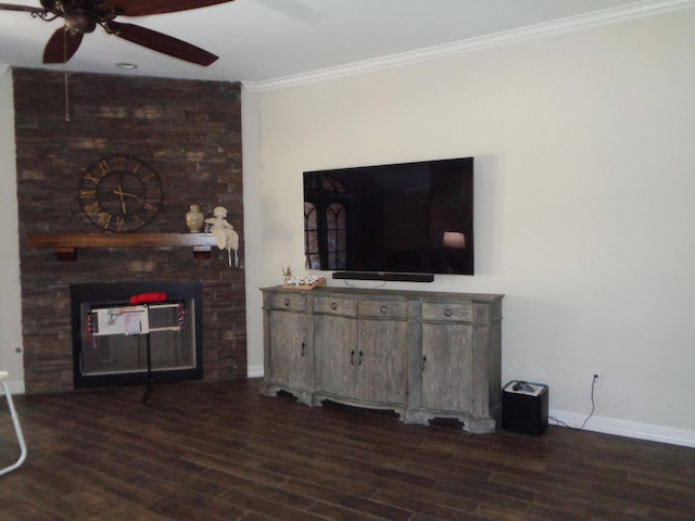 living area with dark wood finished floors, a brick fireplace, ornamental molding, and ceiling fan