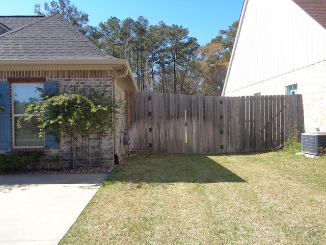 view of yard with cooling unit and fence