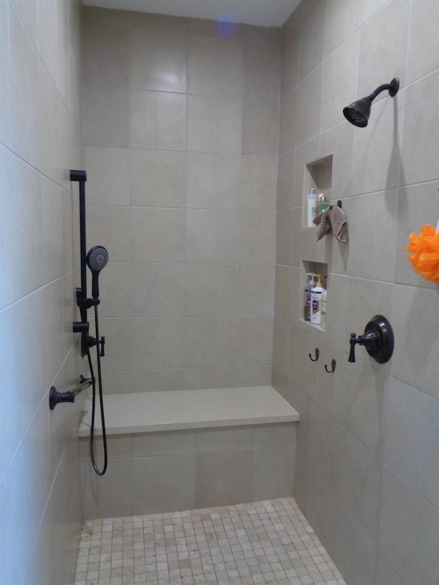 bathroom with tiled shower