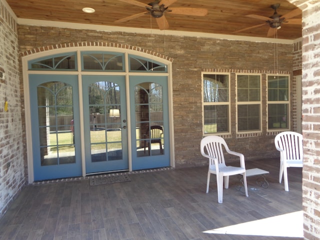 wooden terrace with a ceiling fan