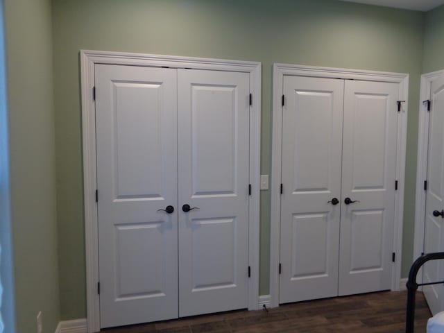 interior details with baseboards and wood finished floors