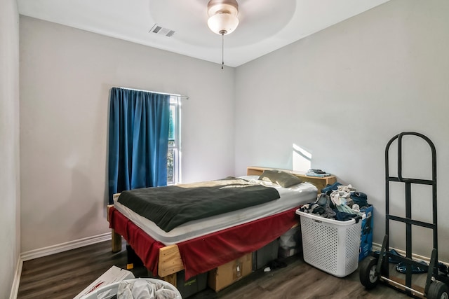 bedroom featuring dark hardwood / wood-style flooring and ceiling fan