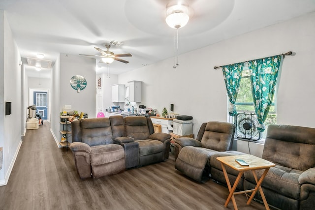 living room with hardwood / wood-style floors and ceiling fan