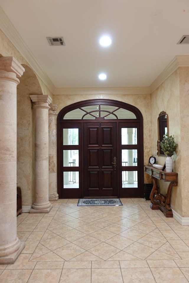7840 Halliday St, Beaumont, TX 77706 - foyer with decorative columns, ornamental molding, arched walkways, and recessed lighting