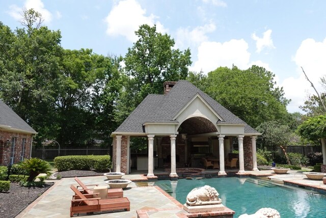 7840 Halliday St, Beaumont, TX 77706 - view of pool featuring a storage structure, a patio area, and an outdoor structure