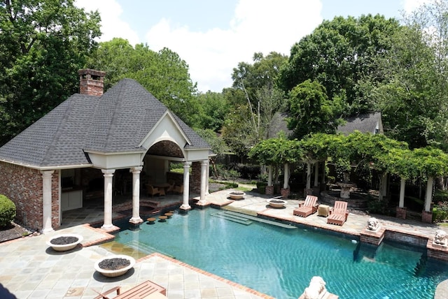 7840 Halliday St, Beaumont, TX 77706 - swimming pool with a storage structure, a patio, and an outdoor structure