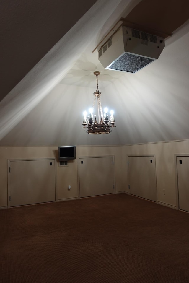7840 Halliday St, Beaumont, TX 77706 - bonus room with a chandelier, vaulted ceiling, and carpet flooring