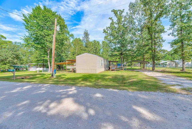 view of yard with a carport