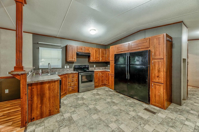 kitchen featuring sink, black refrigerator, electric range, vaulted ceiling, and kitchen peninsula