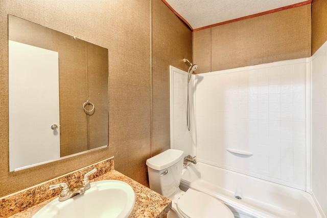full bathroom with vanity, bathtub / shower combination, a textured ceiling, and toilet