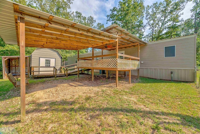 view of yard featuring a storage shed and a deck