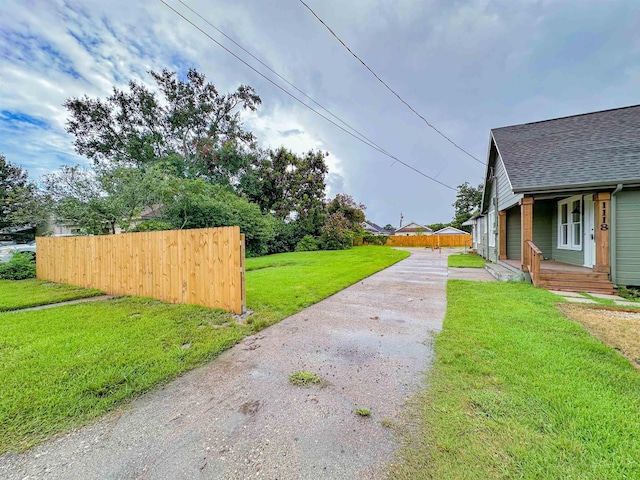 view of yard with covered porch