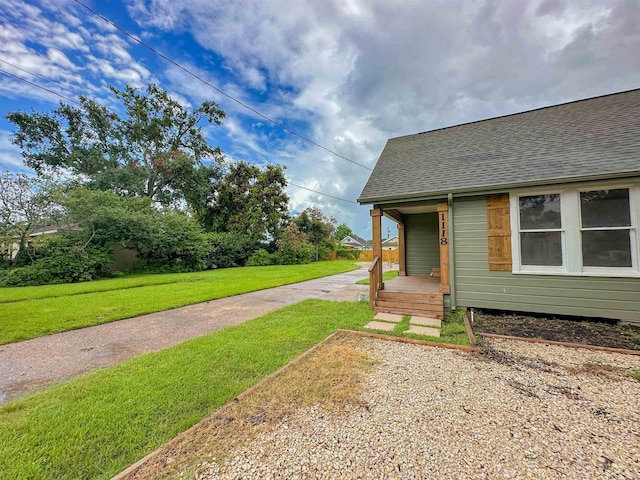 view of yard featuring covered porch