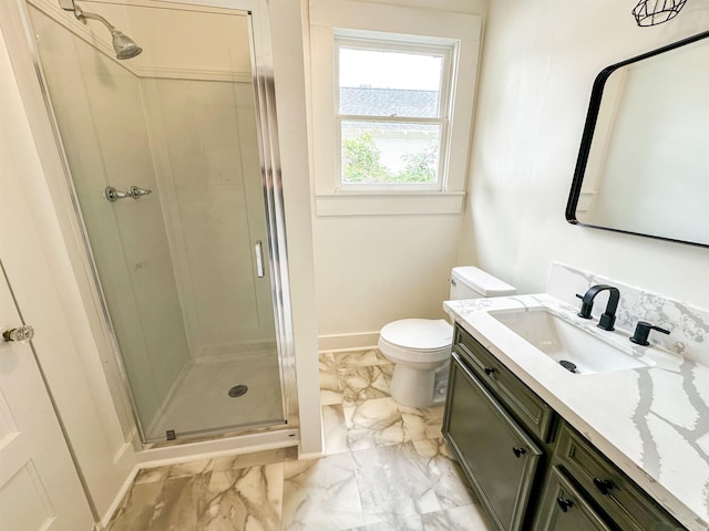 bathroom with vanity, toilet, and an enclosed shower