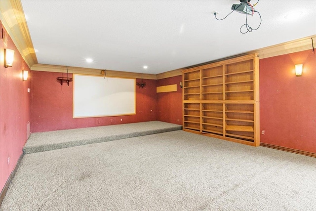 interior space with built in features, carpet, and ornamental molding