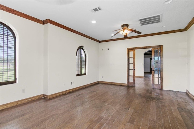 unfurnished room with ceiling fan, ornamental molding, dark wood-type flooring, and a wealth of natural light