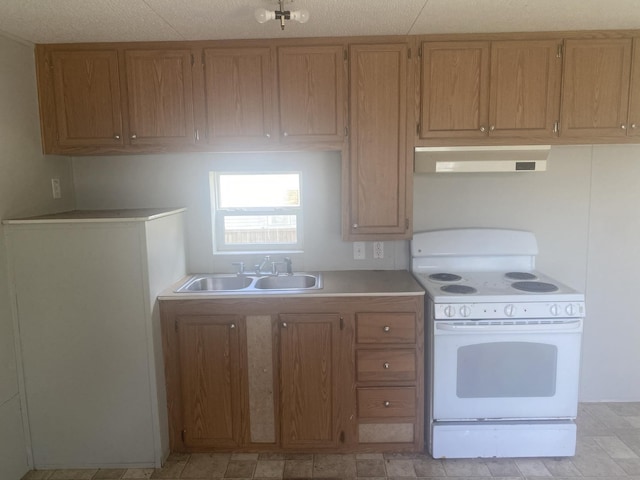 8185 Fm 1122, Silsbee, TX 77656 - kitchen featuring white electric range, range hood, a sink, light countertops, and brown cabinets