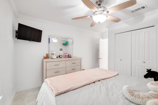 bedroom with crown molding, a closet, ceiling fan, and light tile patterned floors