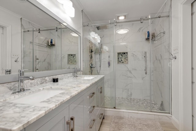 bathroom with vanity, walk in shower, and ornamental molding