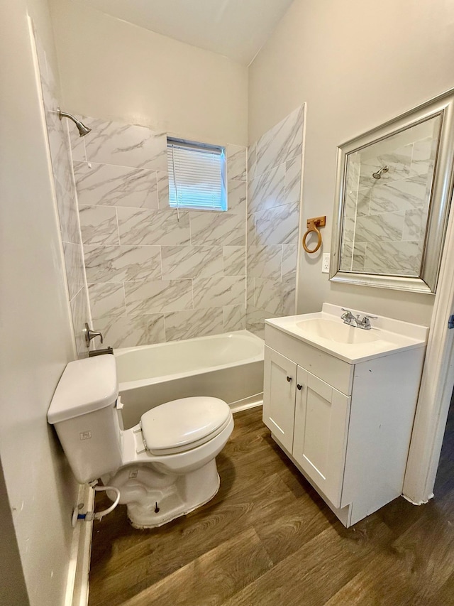 932 Dallas Ave, Port Arthur, TX 77640 - full bath with toilet, vanity, wood finished floors, and washtub / shower combination