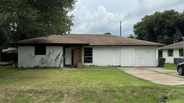 view of front of property with a garage and a front yard