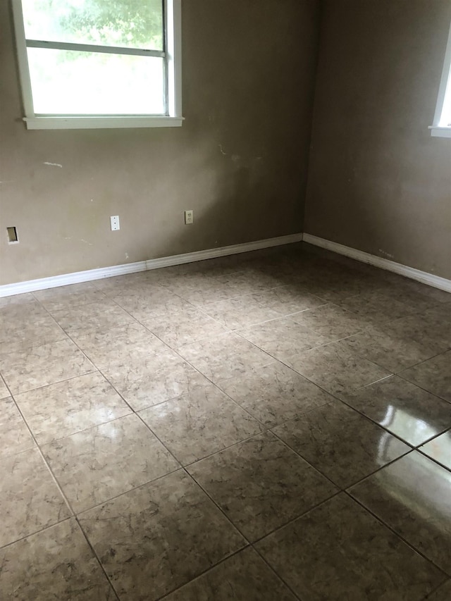 view of tiled spare room