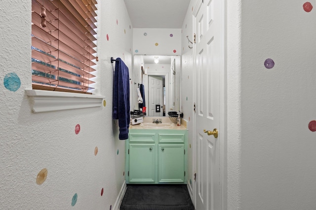 503 Country Wood Cir, Sour Lake, TX 77659 - bathroom featuring vanity and a textured wall