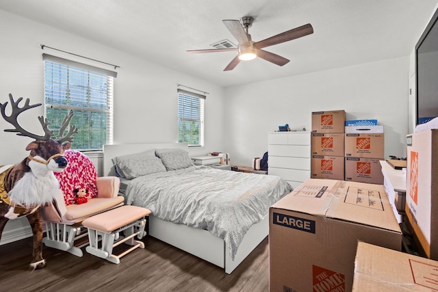 503 Country Wood Cir, Sour Lake, TX 77659 - bedroom with wood finished floors and ceiling fan