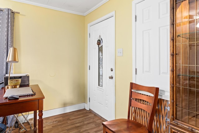 foyer entrance with crown molding and dark wood-type flooring