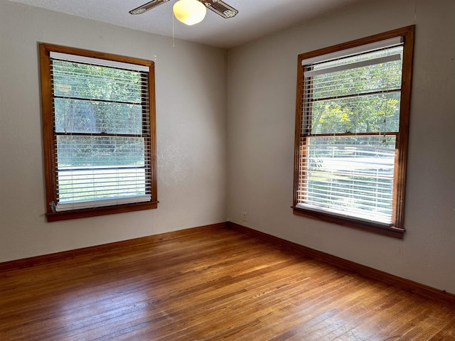 empty room featuring ceiling fan and light hardwood / wood-style flooring