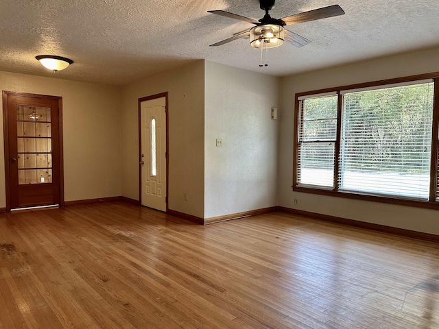 entryway featuring ceiling fan, a textured ceiling, and light hardwood / wood-style flooring