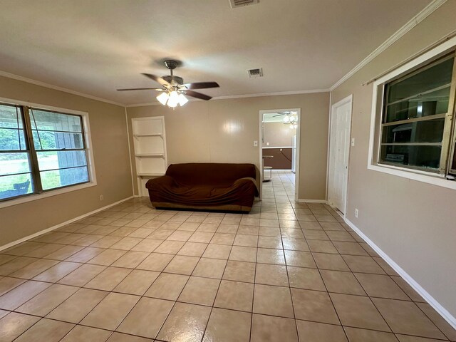 3605 Lawn Oak Dr, Orange, TX 77632 - sitting room featuring a ceiling fan, ornamental molding, built in features, light tile patterned floors, and baseboards