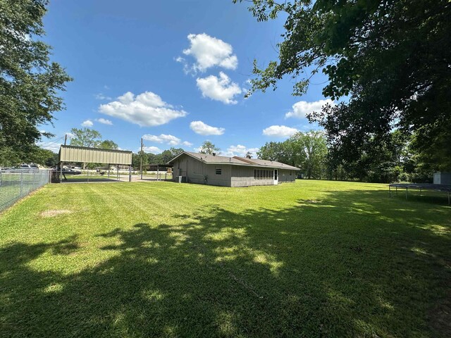 3605 Lawn Oak Dr, Orange, TX 77632 - view of yard featuring a trampoline
