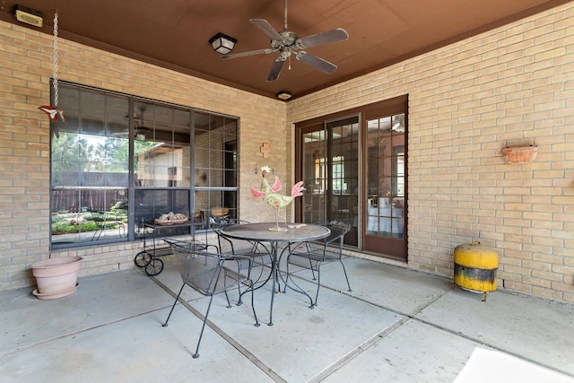 view of patio featuring outdoor dining space and ceiling fan