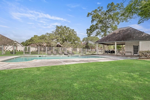 view of pool featuring a yard, a fenced in pool, and fence