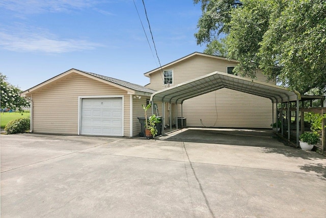 garage with a carport and cooling unit