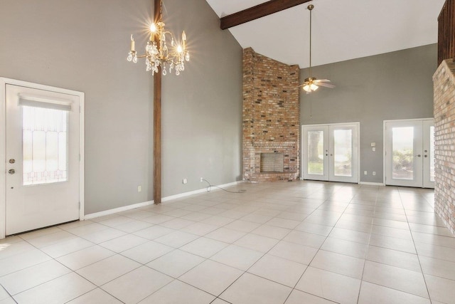 unfurnished living room with light tile patterned flooring, high vaulted ceiling, french doors, ceiling fan with notable chandelier, and beam ceiling