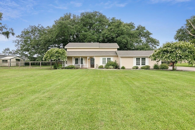 view of front facade with a porch and a front yard