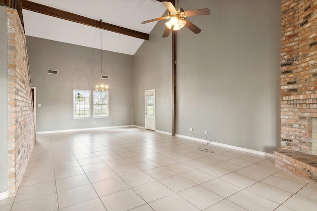 empty room featuring a brick fireplace, ceiling fan with notable chandelier, high vaulted ceiling, beamed ceiling, and light tile patterned flooring