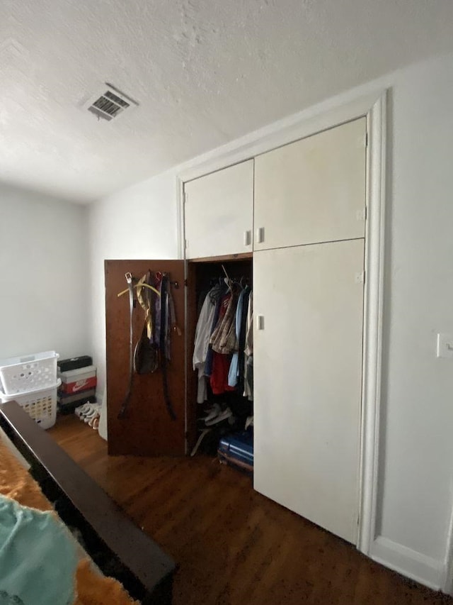 3600 Main Ave, Groves, TX 77619 - mudroom featuring wood finished floors and a textured ceiling