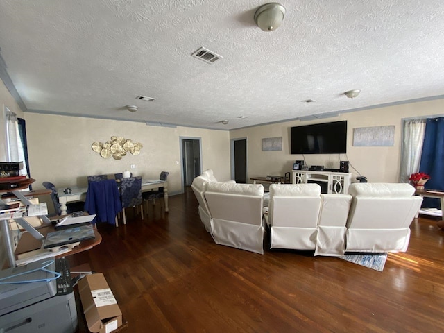3600 Main Ave, Groves, TX 77619 - living area with wood finished floors, a textured ceiling, and ornamental molding