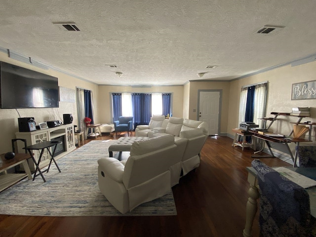 3600 Main Ave, Groves, TX 77619 - living area with crown molding, wood finished floors, a textured ceiling, and baseboards