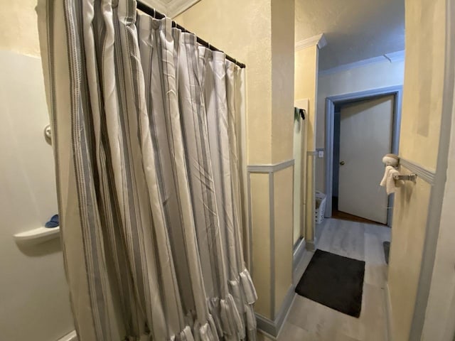 3600 Main Ave, Groves, TX 77619 - full bathroom with crown molding, a shower with shower curtain, and wood finished floors