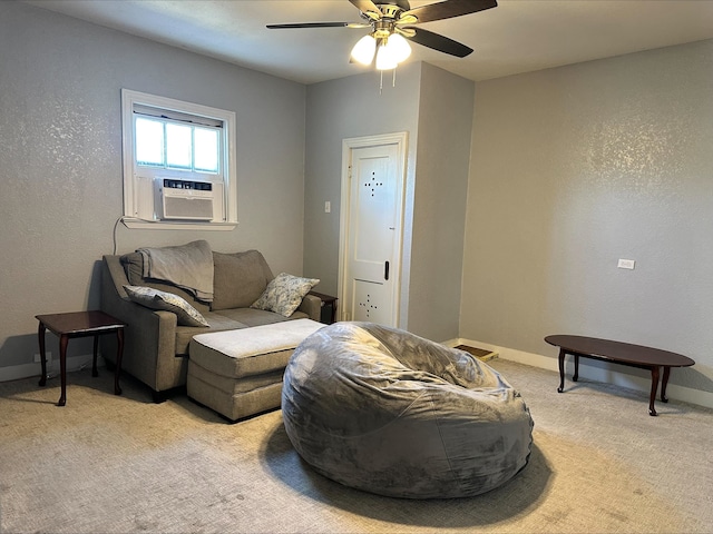 living room with cooling unit, light carpet, and ceiling fan