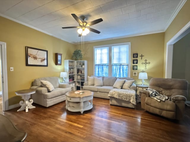 living room featuring dark hardwood / wood-style floors, ceiling fan, and ornamental molding